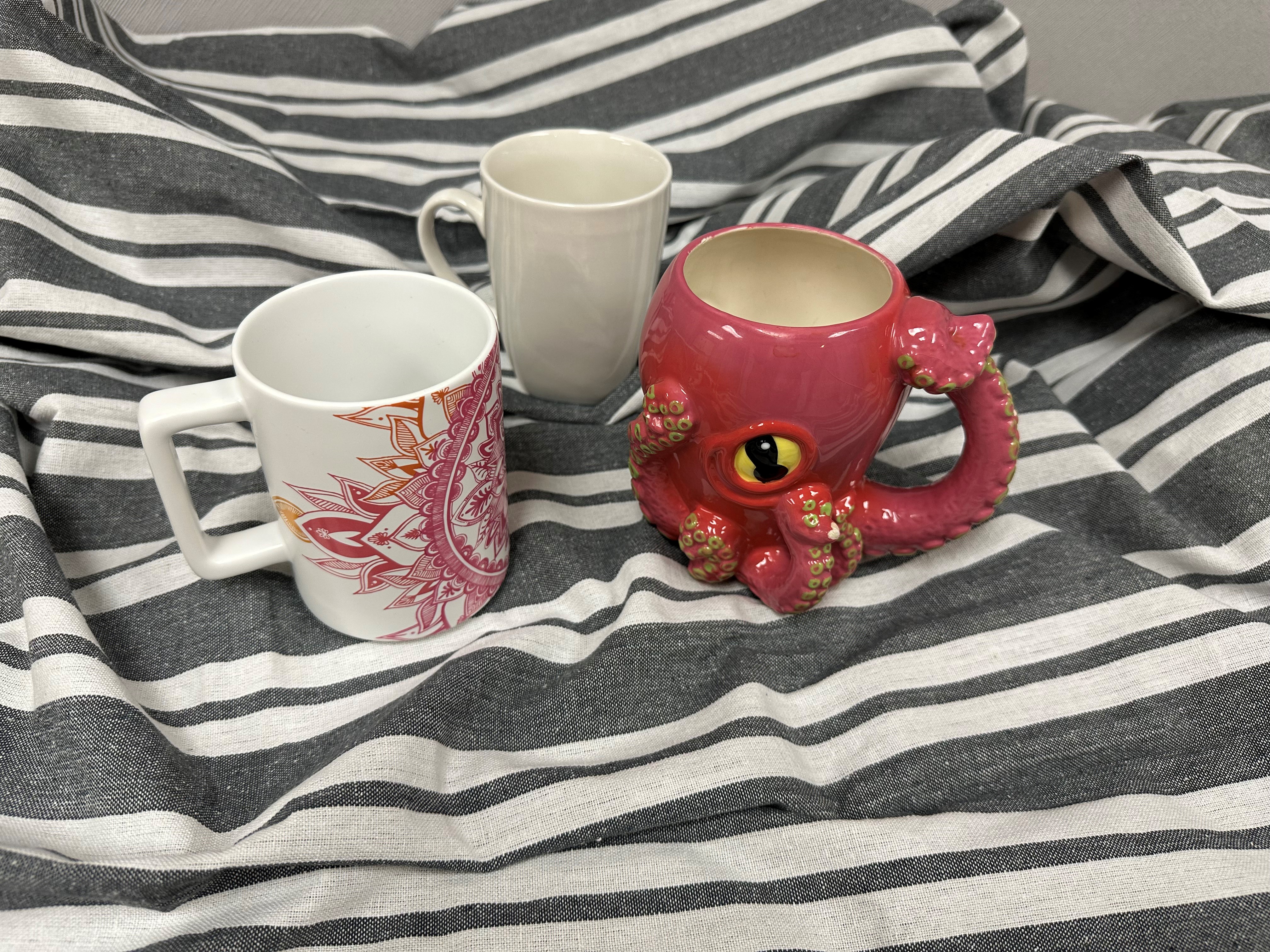 image of striped table cover with three coffee mugs